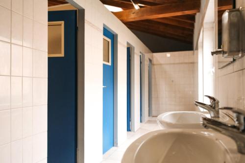 a bathroom with a sink and a mirror at Yurt Mongolia - Camp La Belle Vie in Berdorf