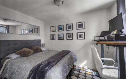 a bedroom with a bed and a desk with a computer at Lavish Columbus Circle Manhattan Apartment by Central Park & Times Square ADULTS ONLY in New York