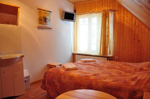 Katil atau katil-katil dalam bilik di Guesthouse Leiputrija