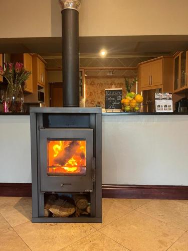 a stove in the middle of a kitchen at Staymore in Stellenbosch