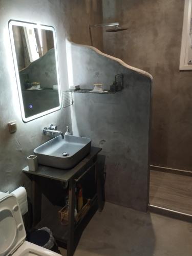 a bathroom with a sink and a mirror at Nova Ledeza NL II in Igoumenitsa