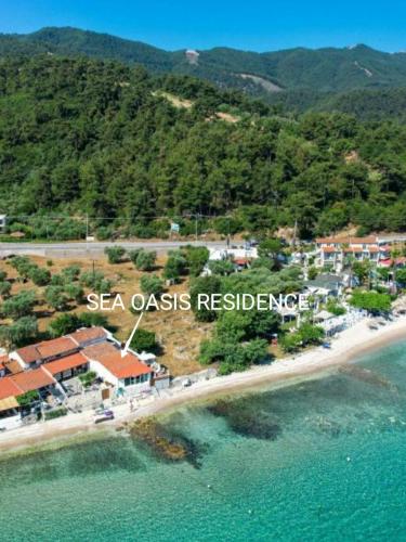 an aerial view of a resort on a beach at Sea Oasis Residence in Limenas