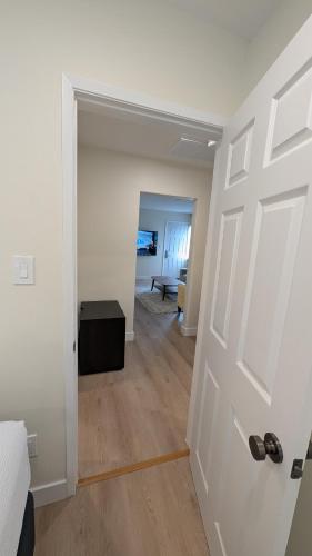 a room with a white door and a bedroom at Rest Haven Motel in Los Angeles