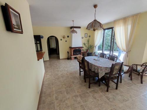 a kitchen and dining room with a table and chairs at Guesthouse Oasis-Shabla in Shabla