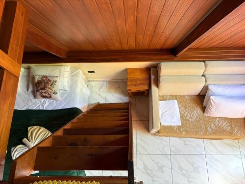 a person laying in a bunk bed in a room at Complexo Turístico Canaã in Nobres