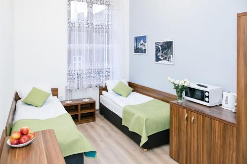 Postel nebo postele na pokoji v ubytování Apartamenty Bonerowska 5