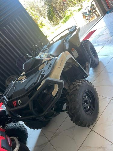 a four wheeler parked on the floor of a garage at Inn R1 Pousada e Passeios in Barreirinhas