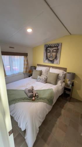 a bedroom with a large bed with a face on it at Brae Lodge Dollar in Dollar