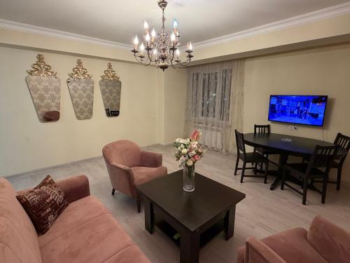 a living room with a couch and a table at Erebuni in Yerevan