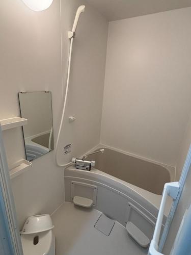 a bathroom with a toilet and a bath tub at Seaside accommodation - Vacation STAY 22044 in Horiechō