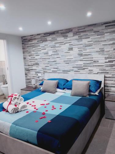 a bedroom with a bed with red hearts on it at House Under Arch in Palermo