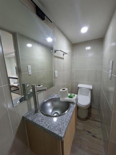 a bathroom with a sink and a toilet at Hotel casa el Palomar - 3 in San Baltasar