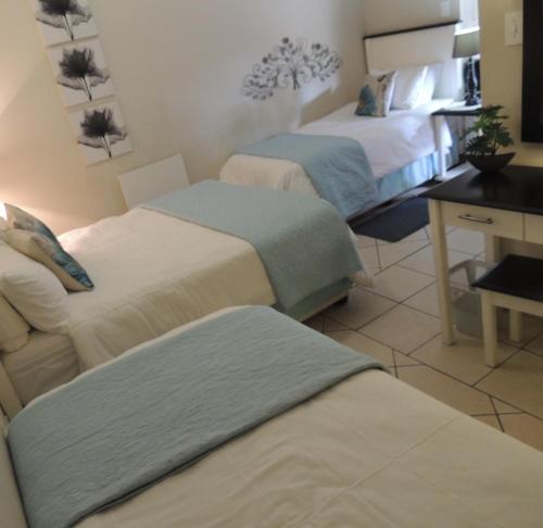 Ένα ή περισσότερα κρεβάτια σε δωμάτιο στο Rita's Guesthouse CC