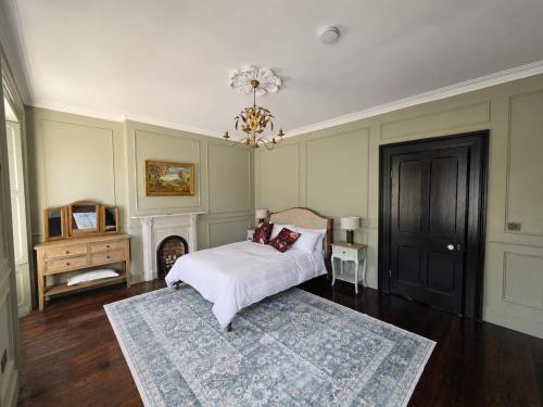 a bedroom with a bed and a chandelier at NO 60 Sligo in Sligo