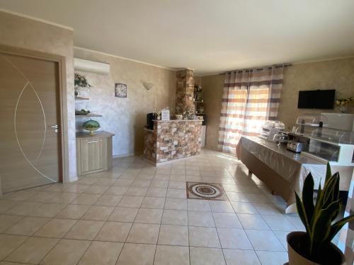 a large room with a kitchen and a living room at Villa Sofia in Parghelia