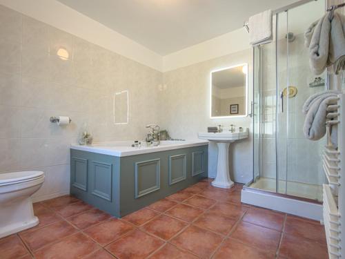 a bathroom with a sink and a shower and a toilet at Ardagh Hotel & Restaurant in Clifden