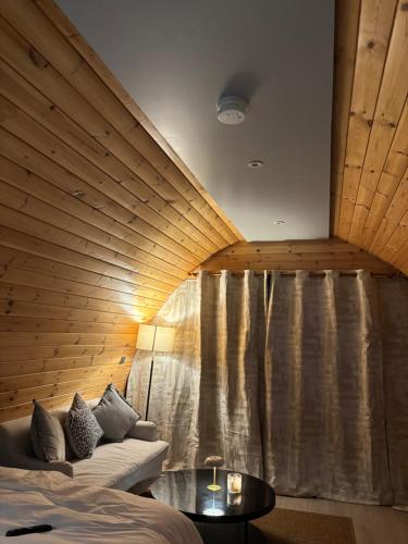 a room with a bed and a large window at Celtic Glamping in Limerick