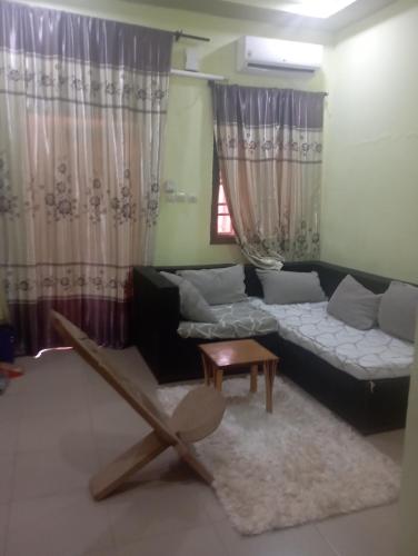 a living room with a couch and a table at Unique in Ouagadougou