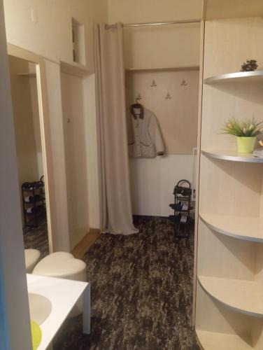 a room with a mirror and a dressing room at Apartments in Bar city center in Bar
