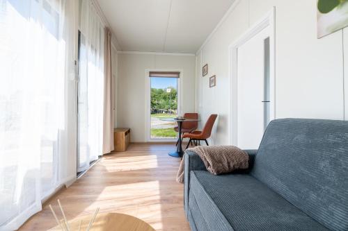 a living room with a couch and a table at Ubytovanie Pod Farou Bojnice in Bojnice