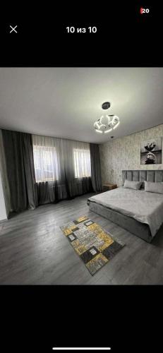 a bedroom with a large bed and curtains at dom in Tbilisi City