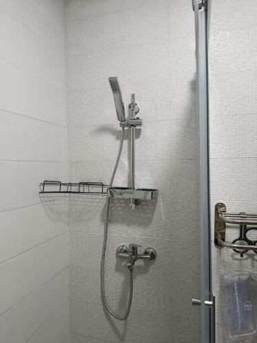a shower in a bathroom with a glass door at Brand new apartment in Sport city Tangier in Tangier