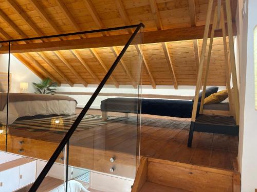 a room with a bed and a glass table at Casas Morgado in Valada