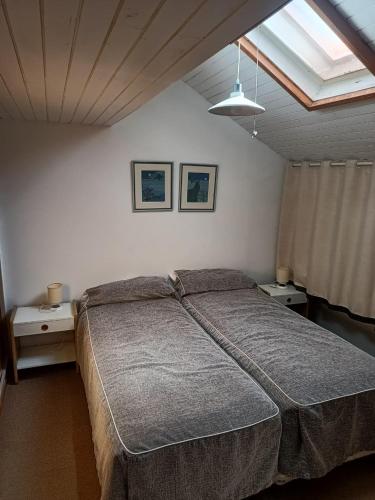 a bedroom with a large bed and two night stands at Apart Las Lenas in Las Lenas