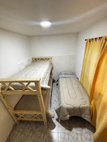 a room with two bunk beds and a table at Depto hube in La Banda