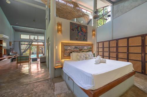 a bedroom with a large bed in a room at Union House with generator in Dapa