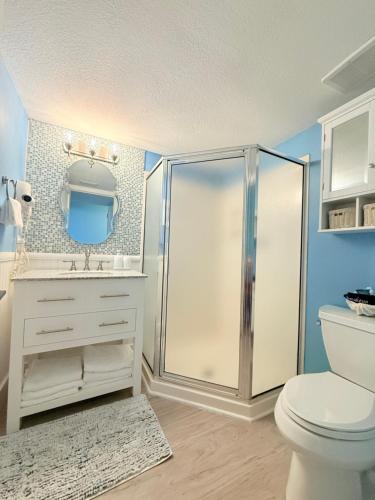 a bathroom with a shower and a toilet at Beachfront Condos in Destin in Destin