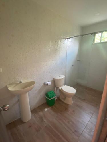 a bathroom with a sink and a toilet at Dream Country Cabin in Cañaveral