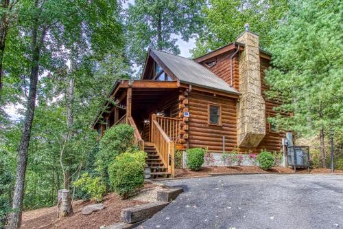 a log cabin in the woods with a driveway at Afternoon Delight 1 Bedroom Cabin Rental between Gatlinburg and Pigeon Forge Great Couple getaway in Sevierville