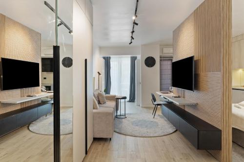 a hotel room with a bed and a desk at Beach Bliss std in Infinity Pool & Spa Resort in Năvodari