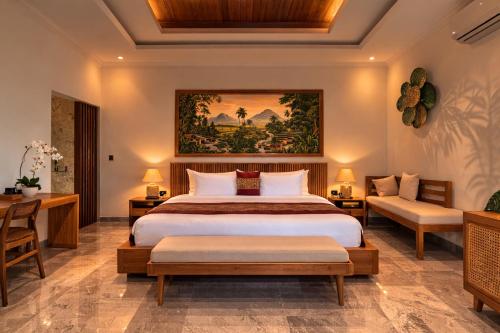 a bedroom with a king sized bed and a couch at Arvanya Villa Ubud in Tegalalang