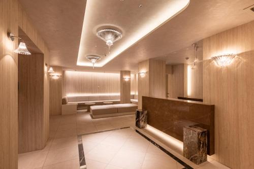 a lobby with a waiting room with a couch and avisor at RHUMB LINE Tokyo in Tokyo