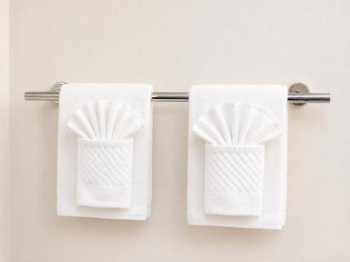 two towels hanging on a towel rack in a bathroom at Sleep Inn Staunton in Staunton