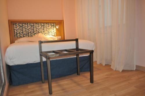Cama o camas de una habitación en Hotel Celanova