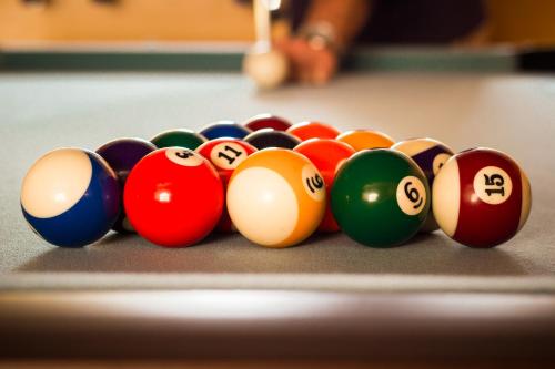 a group of pool balls on a billiard table at Aux Ronzières in Pouilly-sous-Charlieu