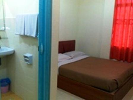 מיטה או מיטות בחדר ב-Sea Front Hotel Port Dickson