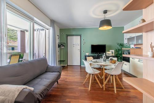 a living room with a couch and a table at Suite 22 - Happy Rentals in Riva del Garda
