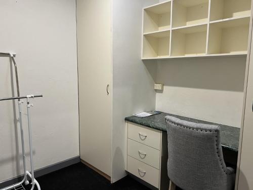 an office with a desk and a chair in a room at Invercauld House in Goonellabah