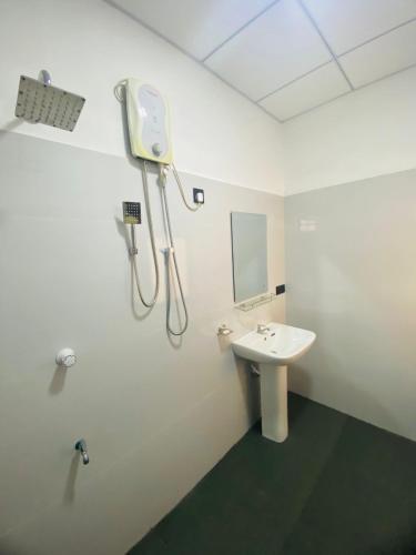 a bathroom with a sink and a mirror at New Vilard in Tissamaharama