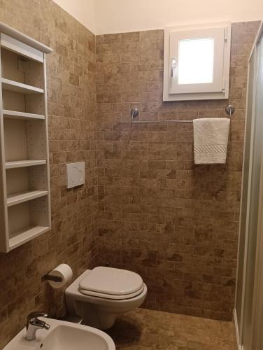 a bathroom with a toilet and a sink at B&B Liberty in Andria