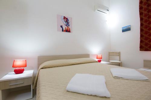 Postel nebo postele na pokoji v ubytování B&B Isole Dello Stagnone