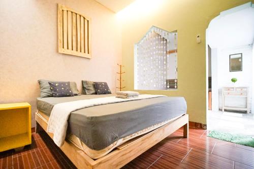 a bedroom with a large bed in a room at Citra Condong Catur in Seturan