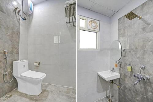 a bathroom with a toilet and a sink at Hotel Grand In Near 2 Min From Vaishali Metro Station in Ghaziabad