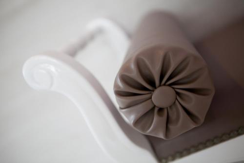 a chocolate cake with a flower on top of it at Hotel Liberty Beach - Parking & Beach in Riccione