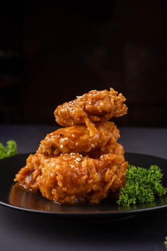 a pile of food on a black plate at Fairfield by Marriott Bali South Kuta in Kuta