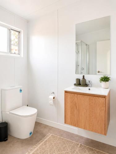 a bathroom with a toilet and a sink at Gem on Matrix - Hidden Retreat with Deck in Lightning Ridge
